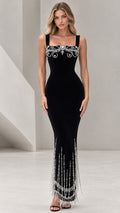 Front view of black square neck maxi evening gown with crystal bodice embellishment and beaded fringe hem