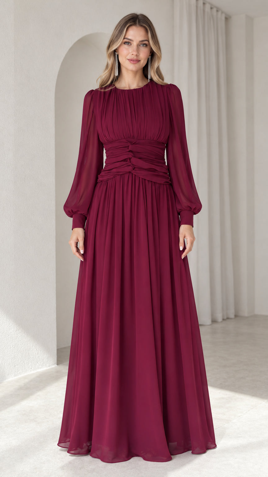 Front view of model wearing burgundy long sleeve chiffon maxi dress with pleated bodice and cinched waist