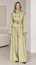 Front view of woman wearing sage green trench jacket and wide-leg pants set