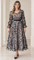 Front view of model wearing gray 3D floral appliqué sequin midi dress with long sleeves