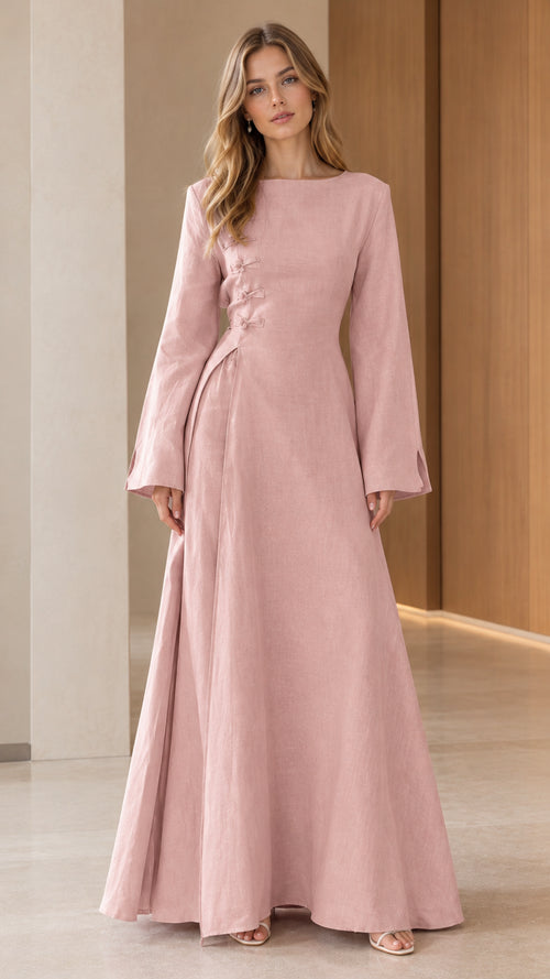 Front view of model wearing Blush Pink boat neck jacquard maxi dress with knot details