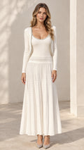 Front full-length view of model wearing ivory white ribbed knit maxi dress and cropped cardigan set