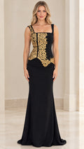 Front view of black square neck mermaid evening gown with gold beaded bodice embellishment