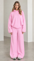 Front full-length view of woman wearing Light Pink oversized hoodie and wide leg lounge pants set
