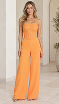 Front full-length view of model wearing orange strapless lace corset wide leg jumpsuit
