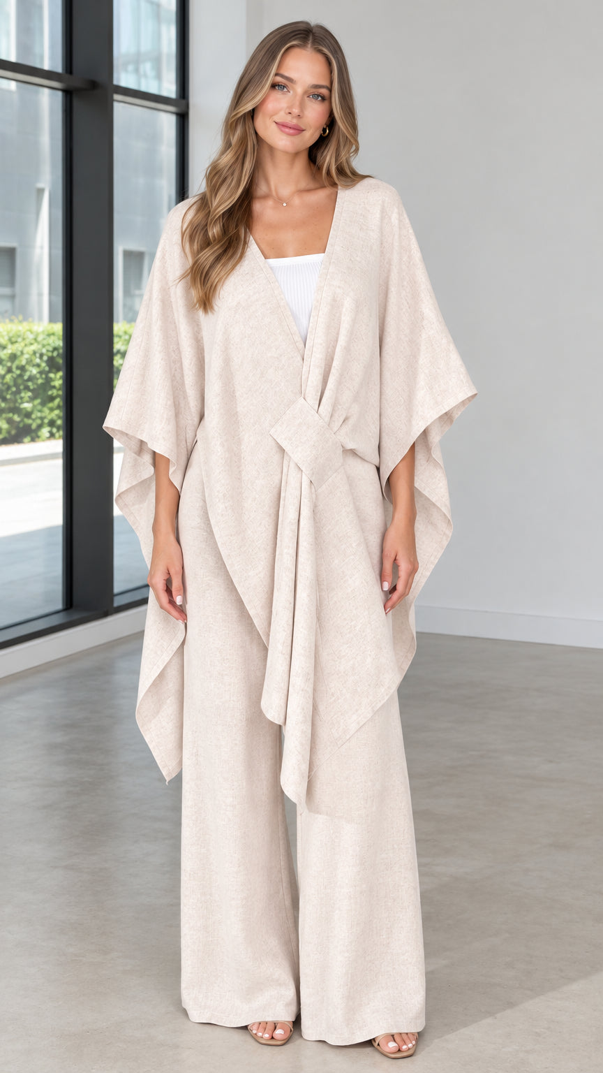Front view of woman wearing beige draped kimono poncho top and wide leg pants set