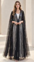 Front view of black sequin floor-length evening cape on model