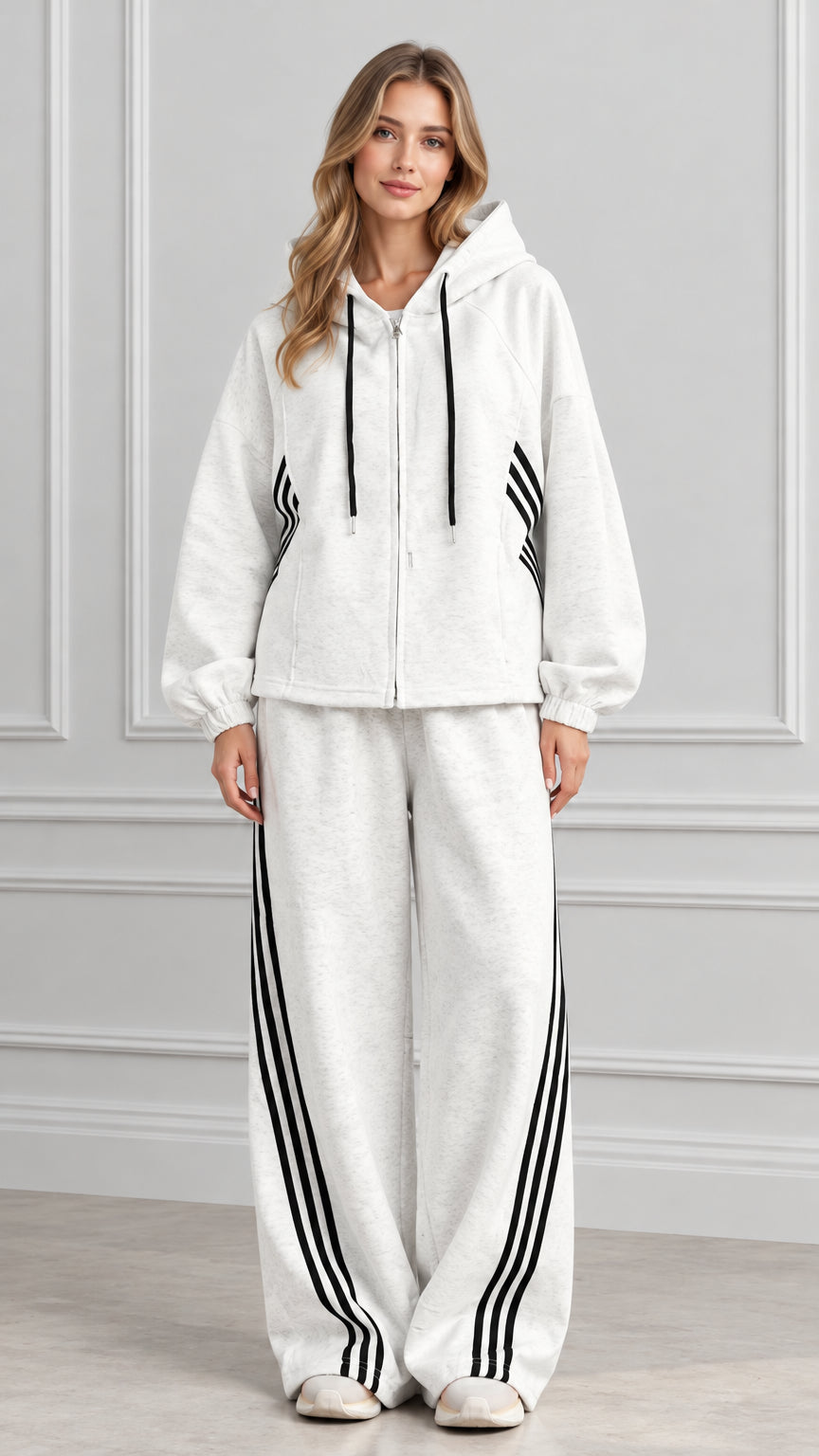 Front full view of woman wearing Heather Gray zip-up hoodie and wide-leg striped track pants set