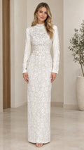 Front view of model wearing White high neck beaded long sleeve column evening dress