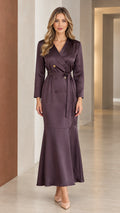 Front view of woman wearing deep plum satin double-breasted mermaid maxi blazer dress