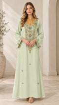 Front full view of woman wearing Mint Green embellished kaftan maxi dress