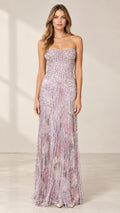 Front full-length view of model wearing lilac strapless beaded fringe evening gown