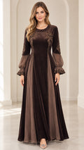 Front view of model wearing brown embroidered velvet maxi dress with sheer lantern sleeves