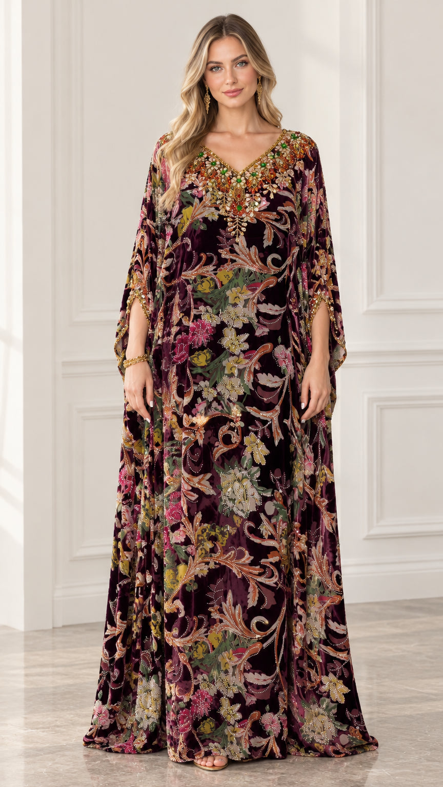 Front view of woman wearing burgundy floral velvet embellished kaftan maxi dress