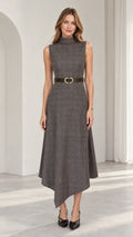 Front view of model wearing charcoal grey sleeveless mock neck midi dress with asymmetrical hem and belt