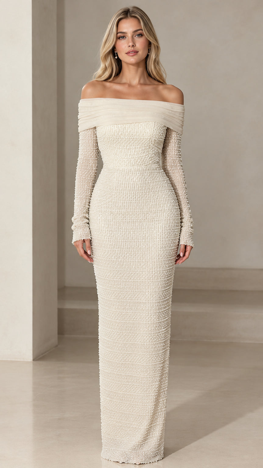 Front view of model wearing ivory off-the-shoulder pearl embellished long sleeve maxi dress