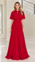 Front view of woman wearing red capelet evening dress with beaded lace bodice