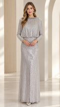 Full front view of a model wearing a long-sleeve silver sequin evening maxi gown