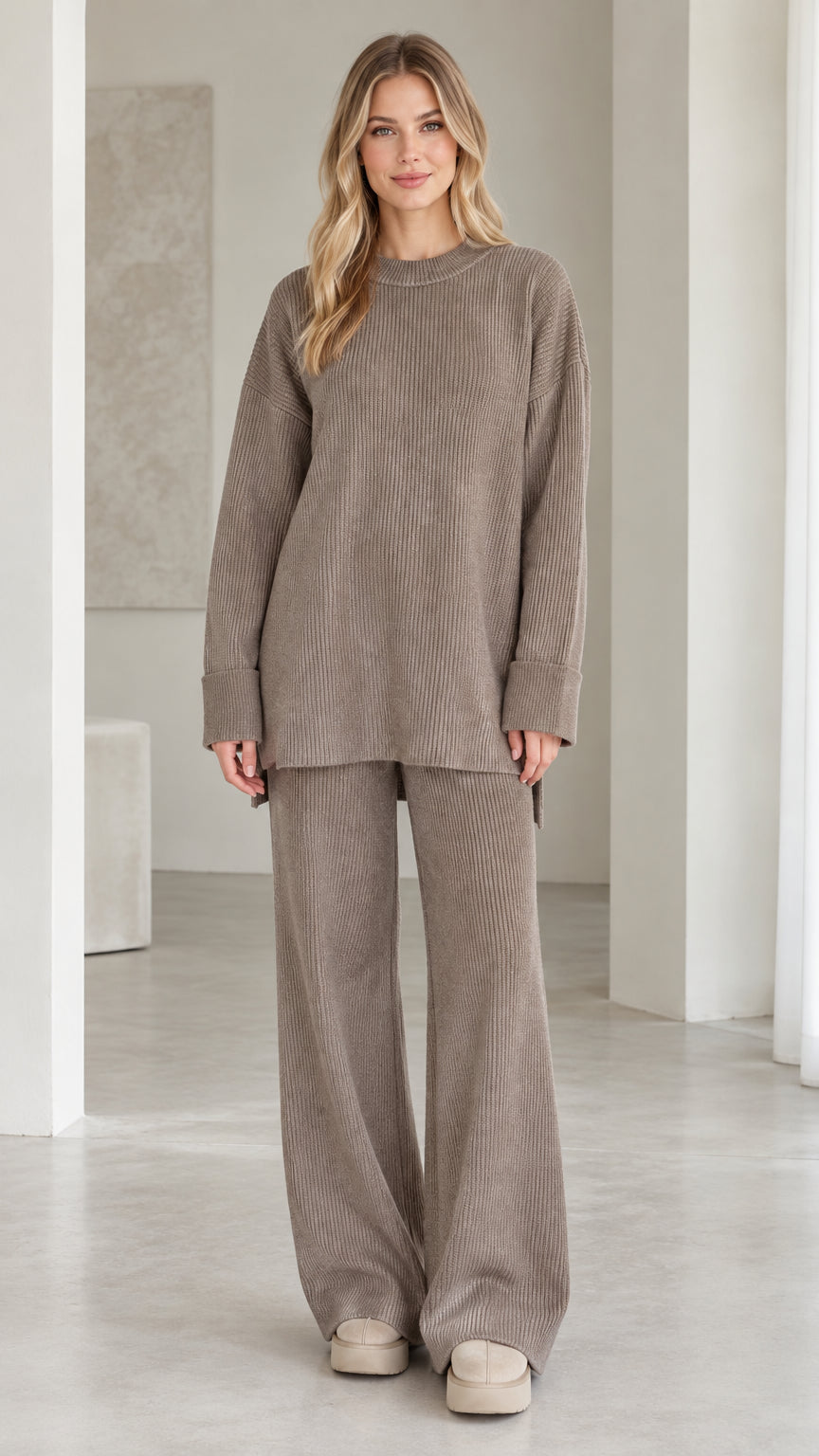 Front view of model wearing taupe ribbed knit two-piece lounge set with oversized top and wide-leg pants