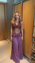Full front view of model wearing mauve beaded halter crop top and matching ruched maxi skirt