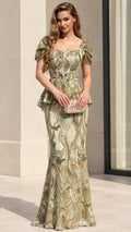 Full front view of model wearing sage green sequin peplum mermaid evening gown