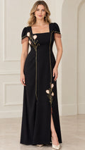 Front view of black square neck maxi dress with floral embroidery and beaded sleeve fringe