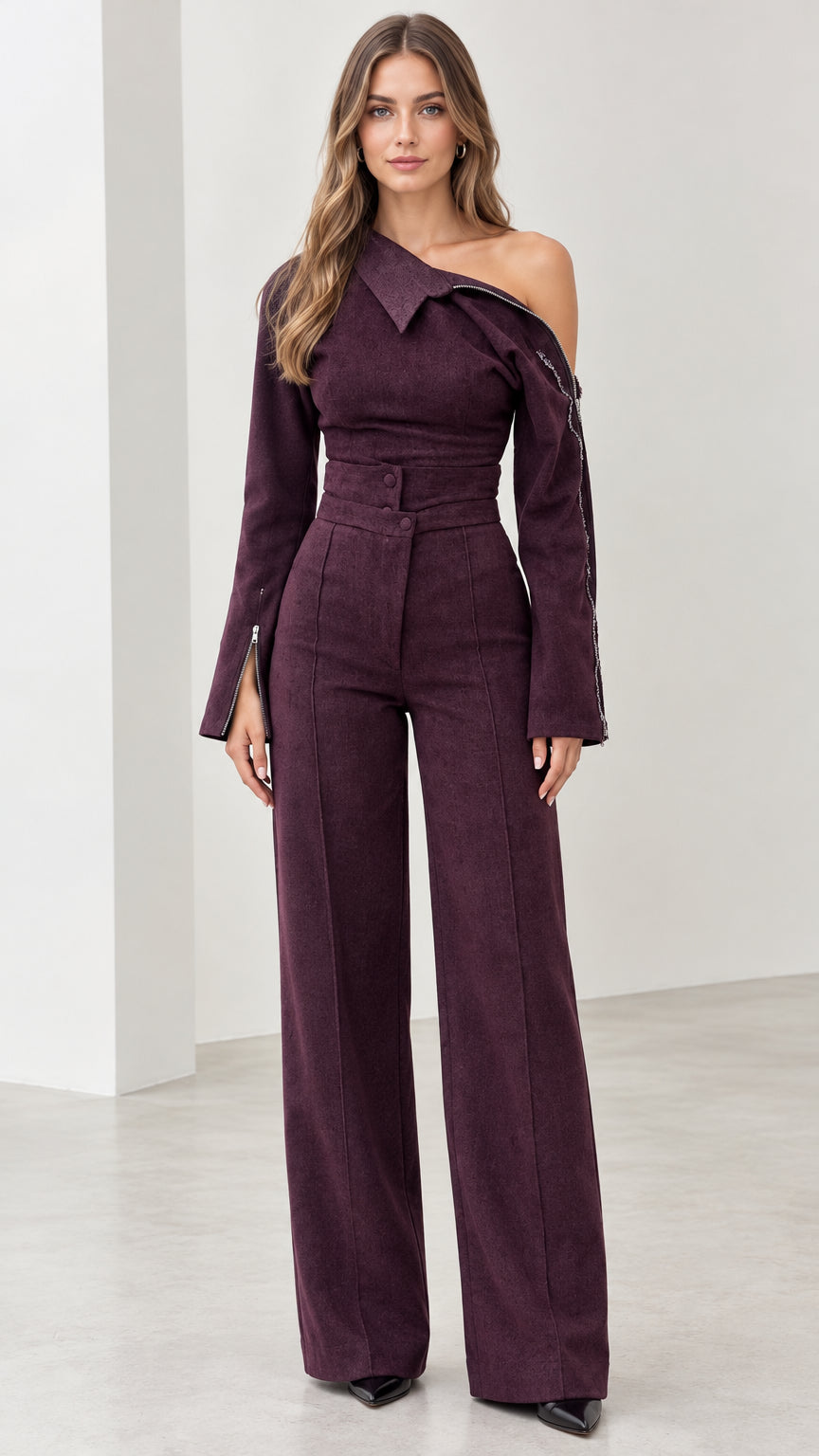 Front view of model wearing plum asymmetric off-the-shoulder wide-leg jumpsuit