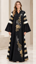 Front full-length view of black embroidered bell sleeve maxi abaya dress