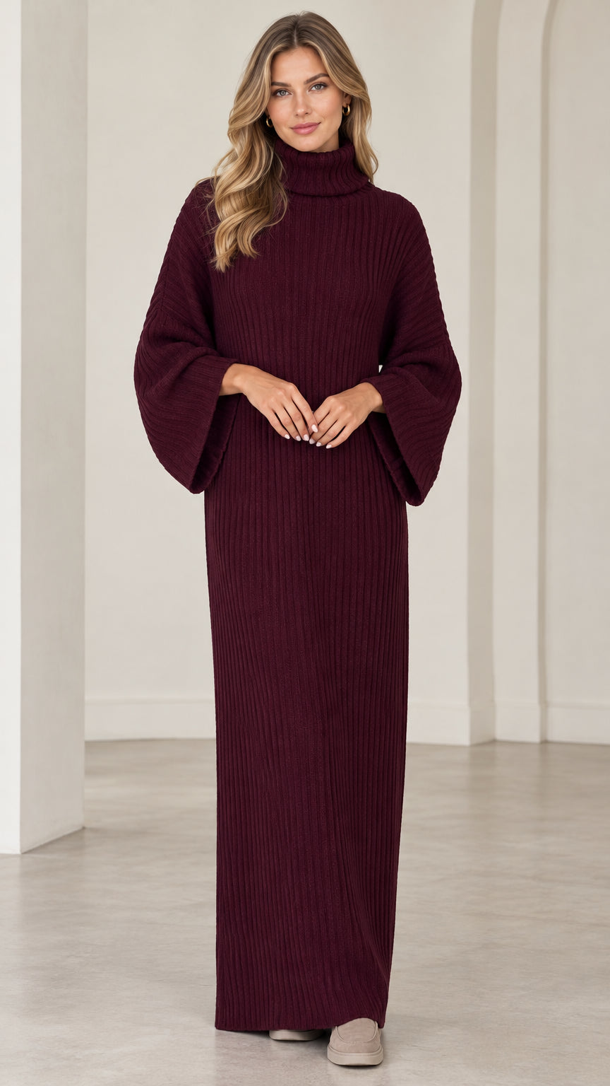 Full front view of model wearing burgundy turtleneck ribbed knit maxi sweater dress with flared sleeves