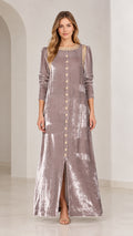 Front view of model wearing mauve crushed velvet maxi dress with embroidered gold neckline