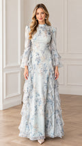 Front view of woman wearing Light Blue floral high-neck maxi dress with tiered ruffle bell sleeves