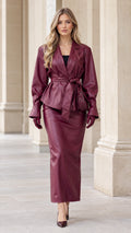 Full front view of model wearing Burgundy faux leather belted blazer and maxi skirt set