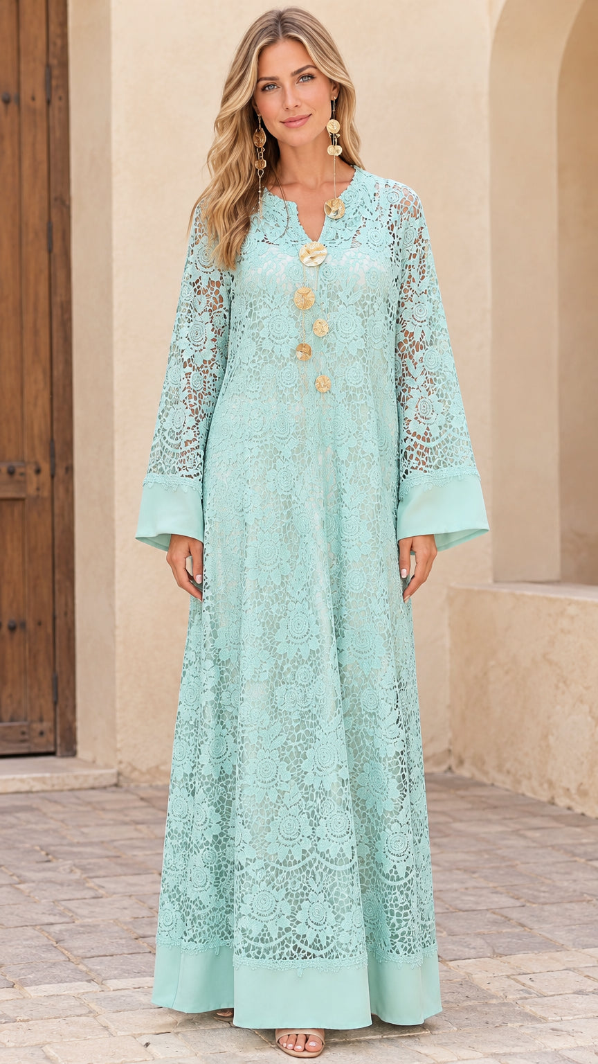 Front view of model wearing Mint Green floral lace kaftan maxi dress with gold accents