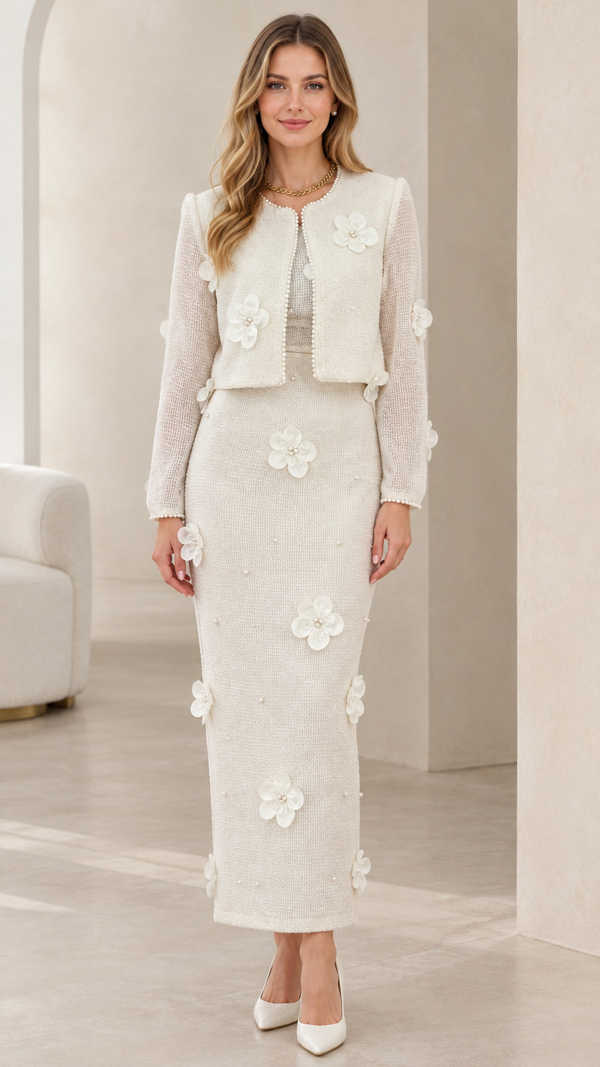 Full front view of model wearing ivory tweed cropped jacket and maxi skirt set with 3D floral appliques