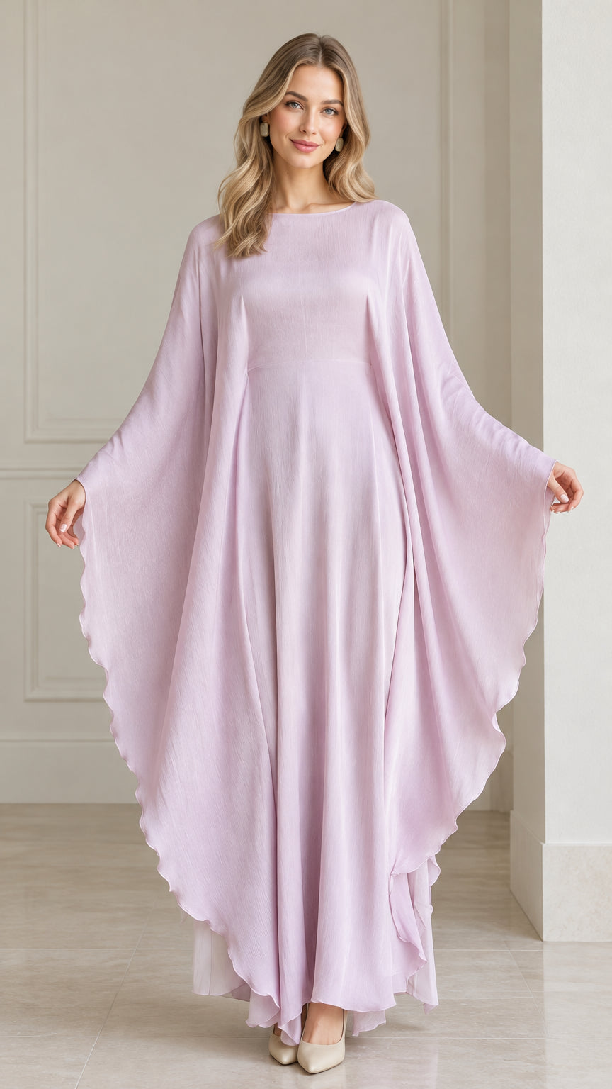 Front view of woman wearing flowing lavender draped cape sleeve kaftan maxi dress