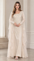 Front view of woman wearing champagne floral embroidered lace evening gown with cape drape