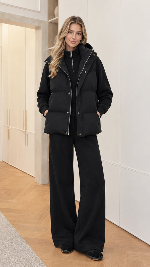 Women's 3-piece black hooded puffer vest and wide-leg tracksuit set front view