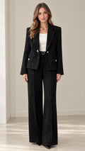 Front full view of woman wearing tailored black tweed blazer and wide leg pants suit set