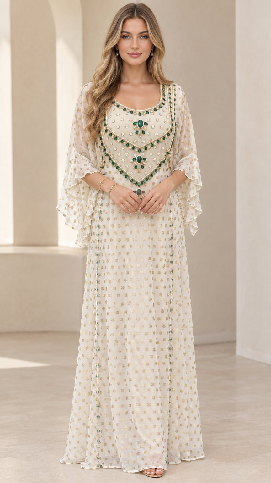 Front full-length view of woman wearing ivory embellished kaftan maxi dress with flutter sleeves