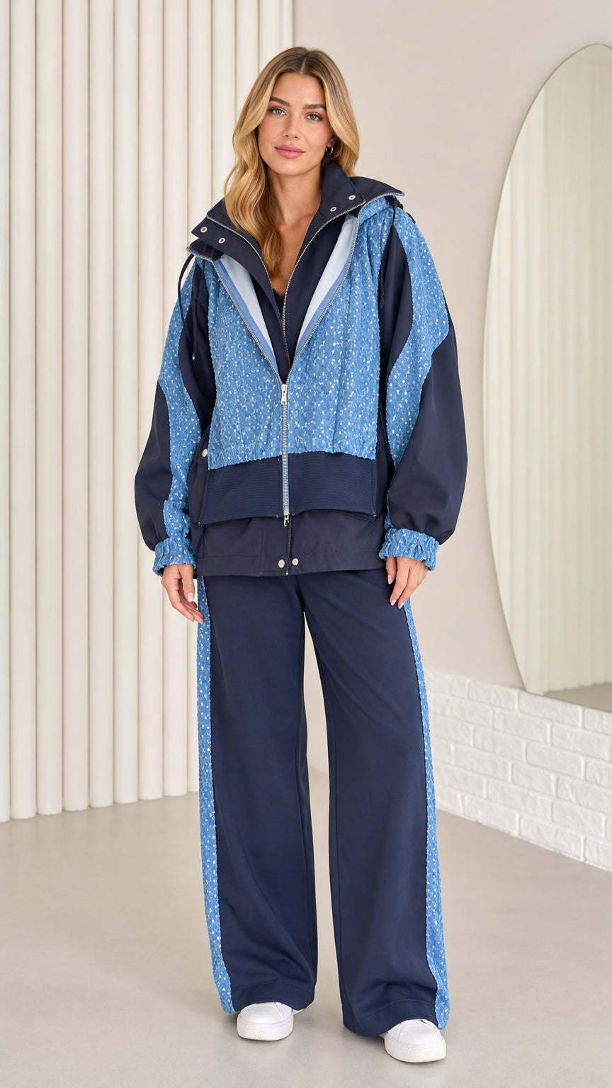 Front full view of women's navy blue sequin hooded windbreaker and wide-leg pants set