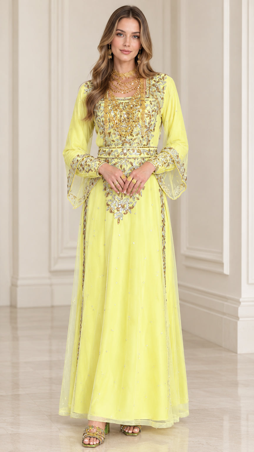 Front full-length view of woman wearing yellow embroidered kaftan maxi dress