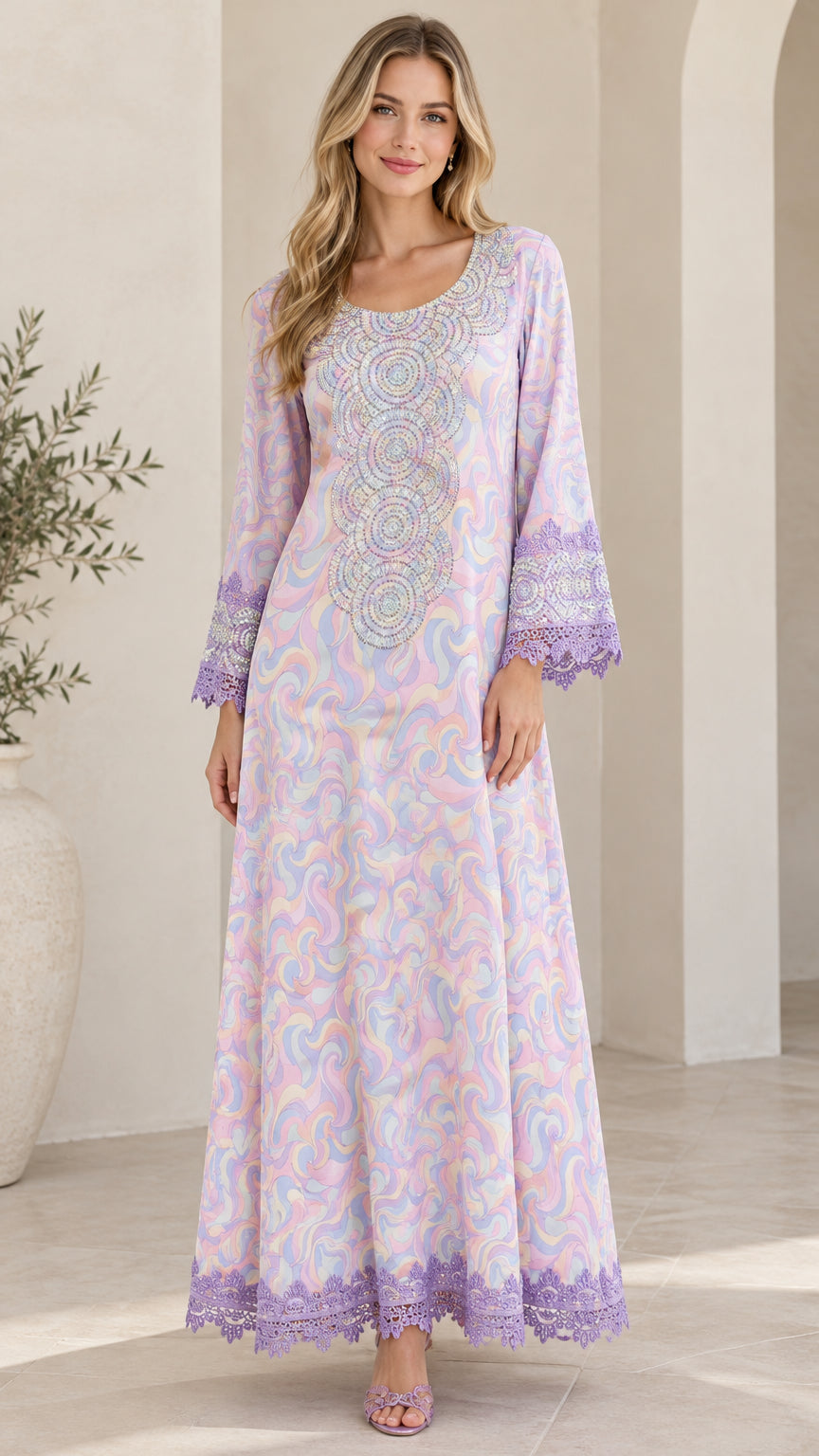 Front full-length view of woman wearing lilac swirl print embellished maxi dress with lace trim