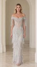 Front view of woman wearing silver off-the-shoulder beaded fringe evening gown