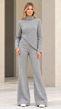 Front view of woman wearing Heather Grey asymmetric top and high-waist flare pants set