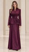 Full front view of elegant burgundy peplum jacket and maxi skirt formal suit set