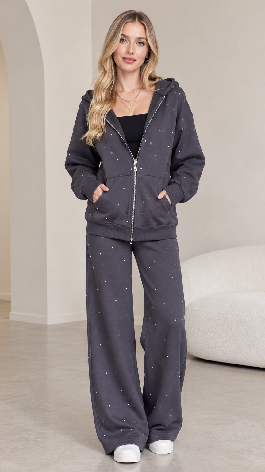 Full front view of model wearing dark grey rhinestone zip-up hoodie and matching wide-leg sweatpants