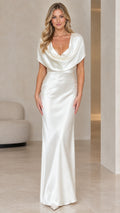 Front view of model wearing ivory cowl neck satin maxi evening gown