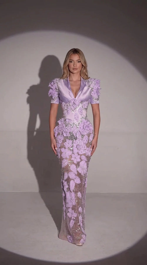 Front full-length view of model wearing lavender 3D floral embellished evening gown