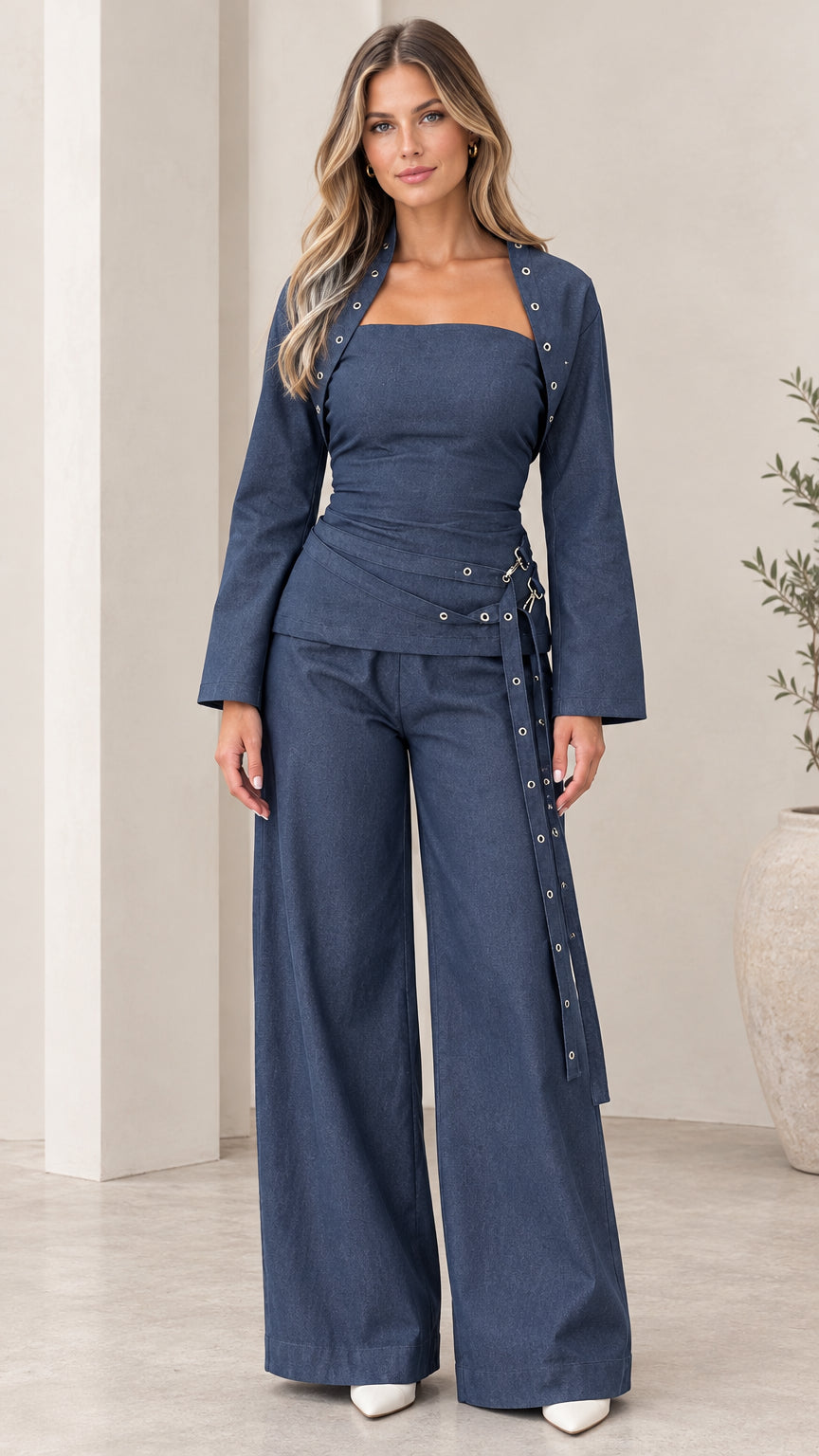 Model wearing Navy Blue 3-piece wide leg pant set with cropped jacket and bandeau top - front view