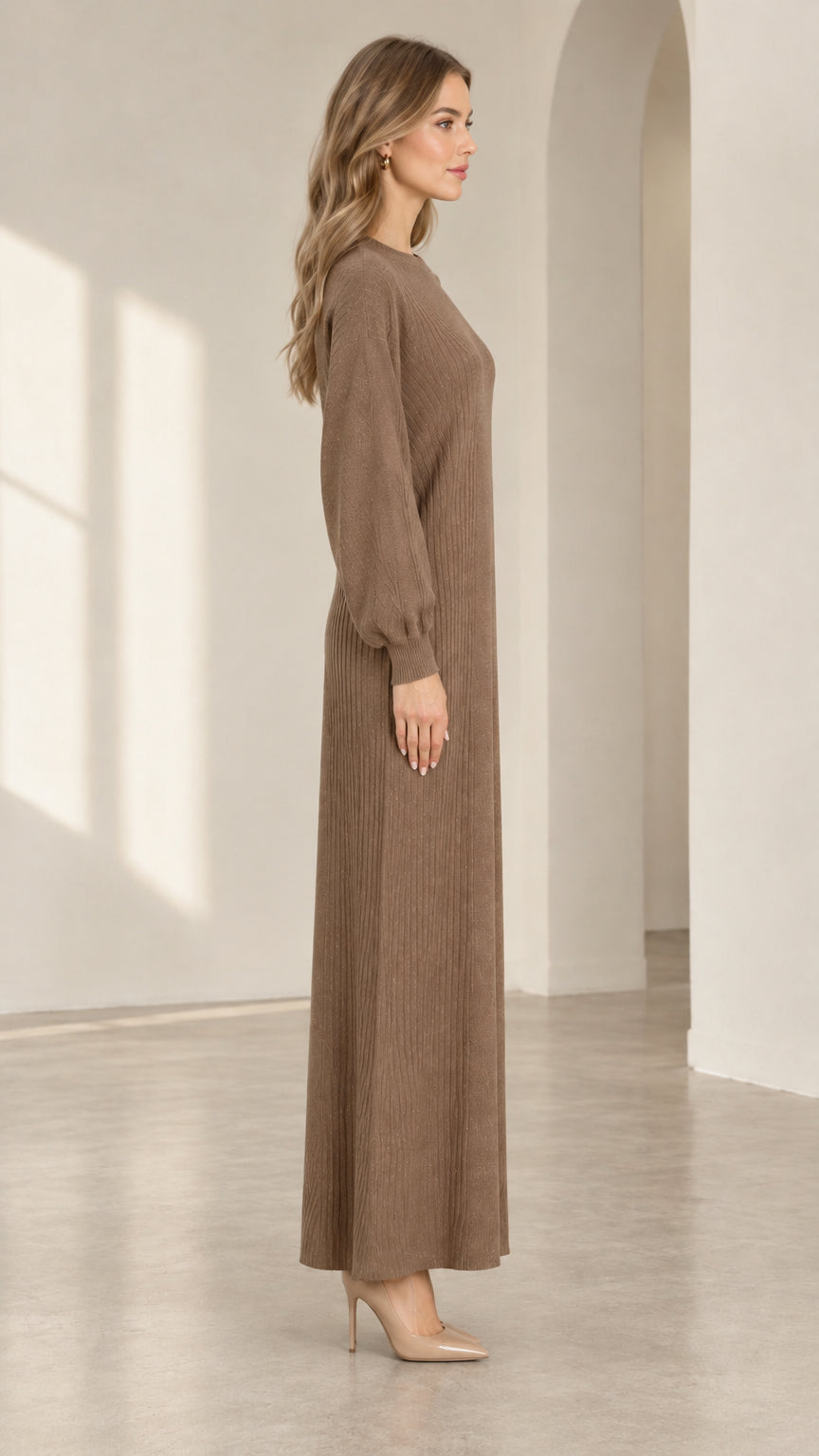 Side view of woman wearing mocha brown crew neck knit maxi column dress